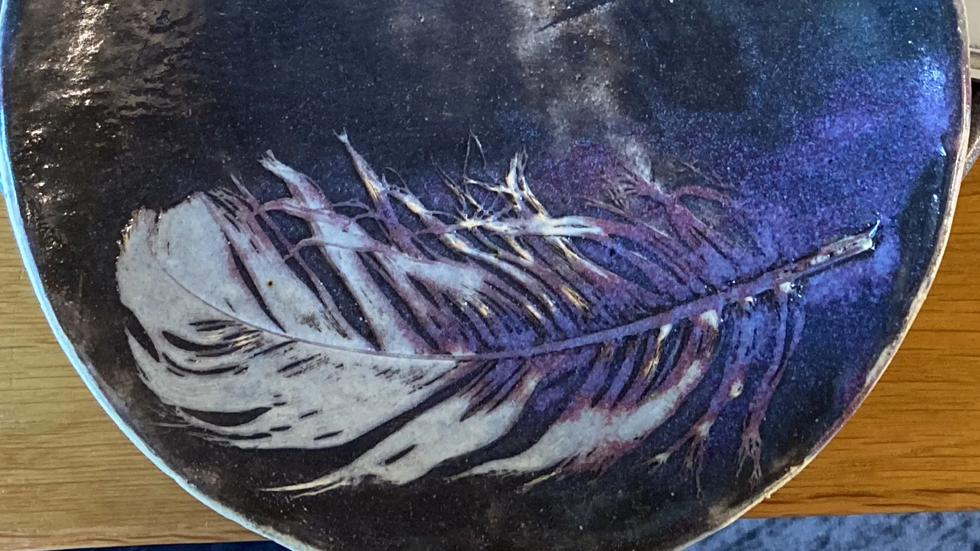 blue ceramic plate with a leaf design