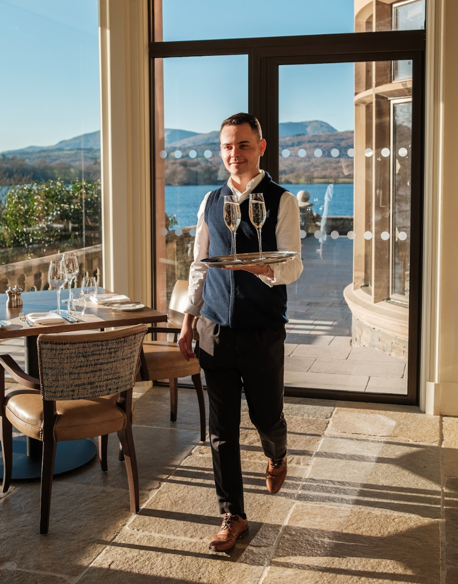 A waiter carrying drinks